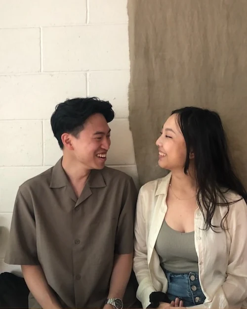 Dan and Kelly smiling at each other